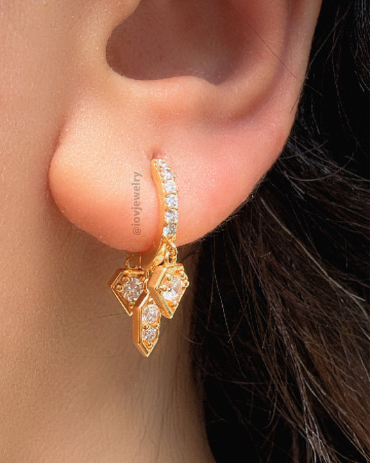 CZ hoop earring with three dangling shapes.