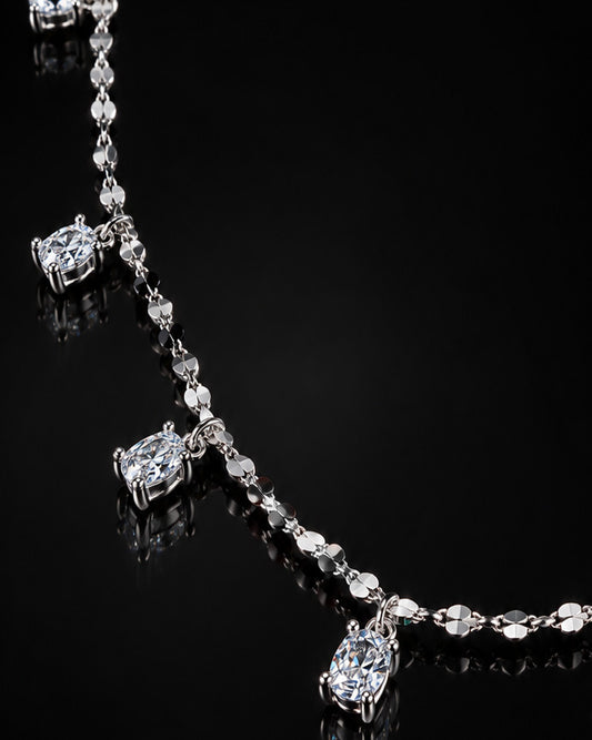 mirror link chain with dangling CZ oval shape stones.