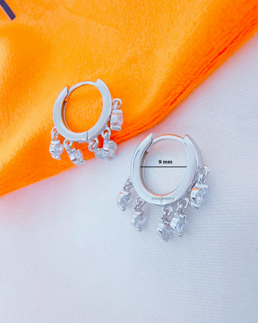 9 mm plain huggie hoop with dangling round CZ.