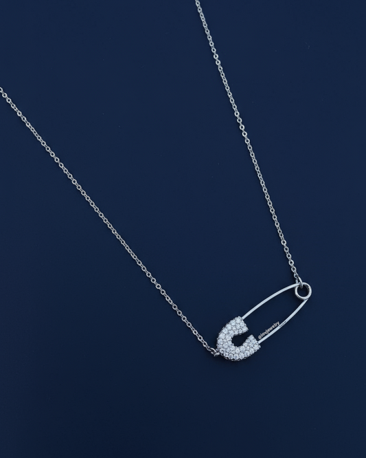 Safety pin shape CZ adjustable length necklace.