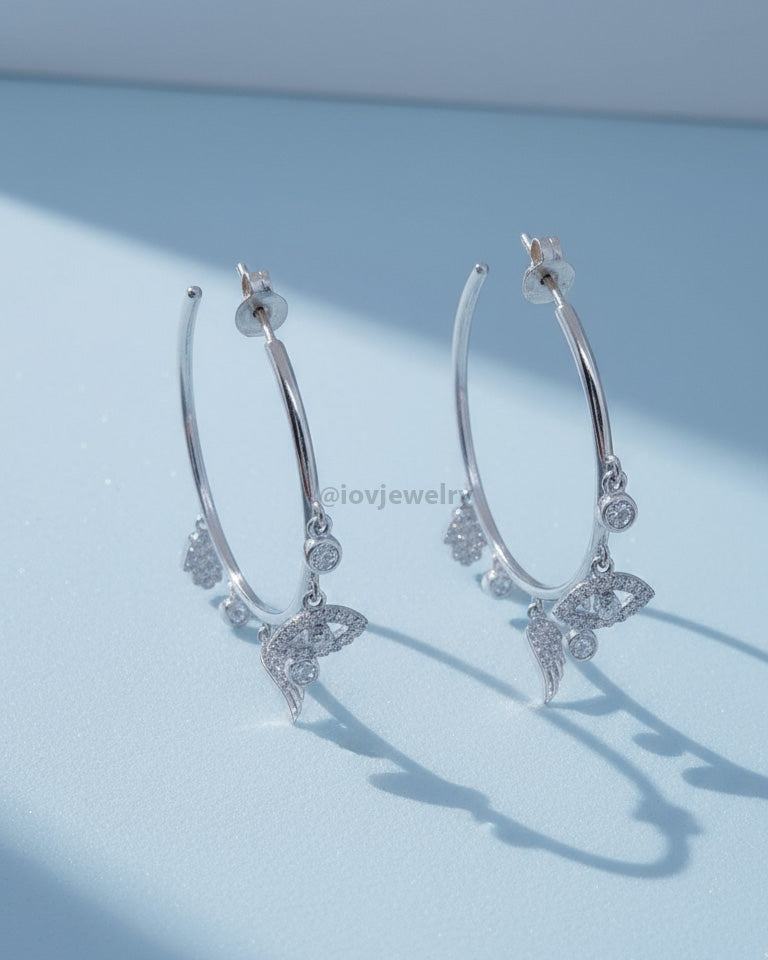 wide plain hoop with dangling CZ charms.