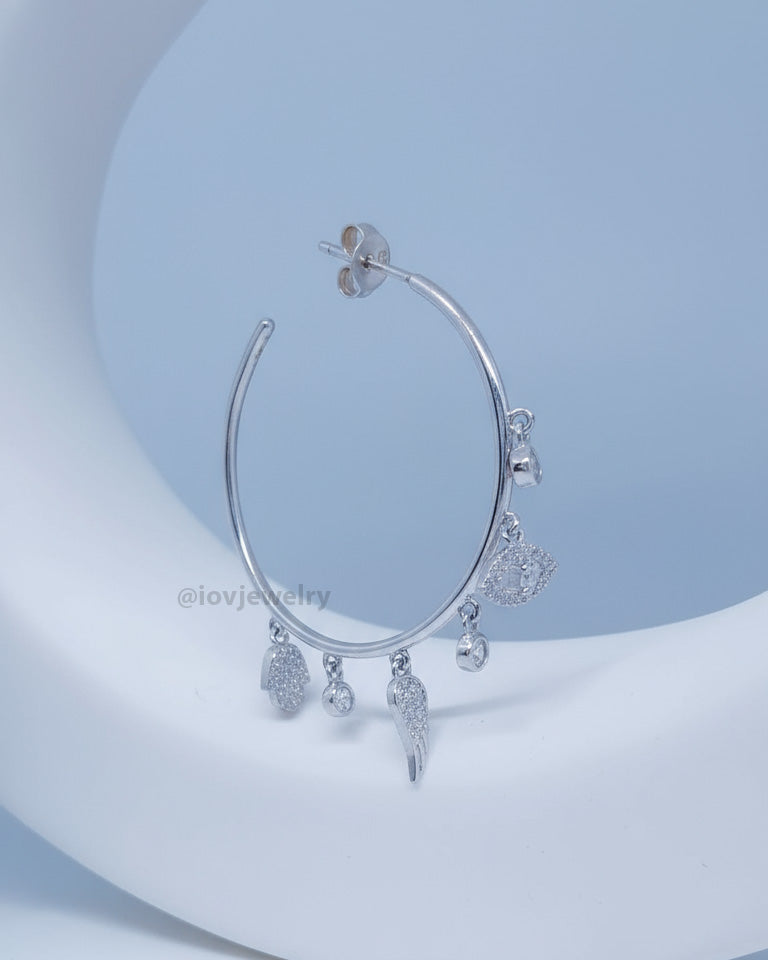 wide plain hoop with dangling CZ charms.