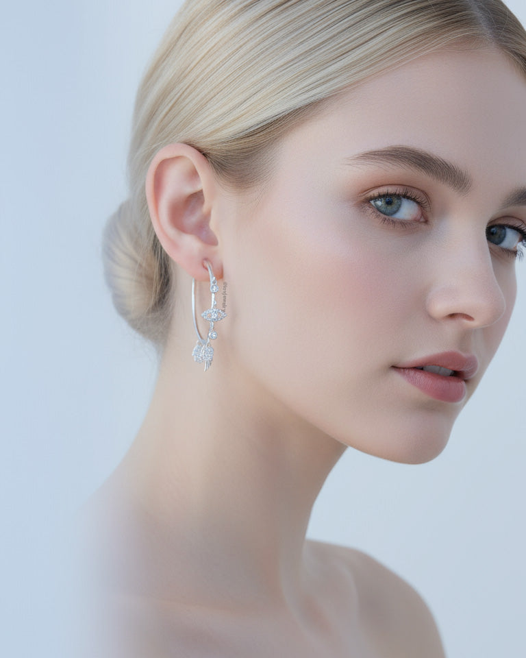 wide plain hoop with dangling CZ charms.