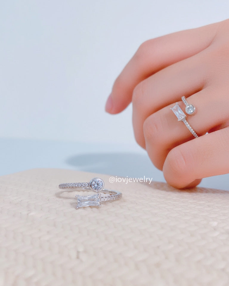 simple adjustable size open ring of baguette and round CZ.