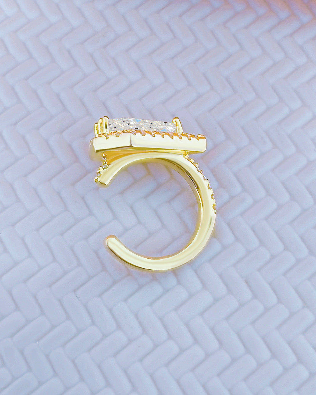 Kite shape stone in a halo setting earcuff.
