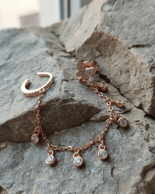 sterling silver rosegold plated butterfly stud earring linked to earcuff with dangling CZ in bezel setting.