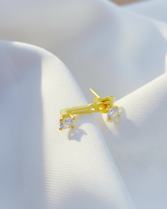 minimal back to front two round CZ earring.