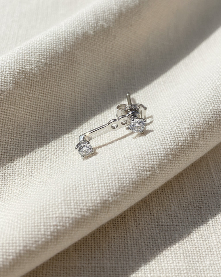 minimal back to front two round CZ earring.