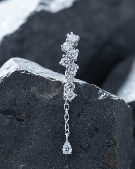 uneven Round CZ arrangement huggie hoop with dangling double chain.