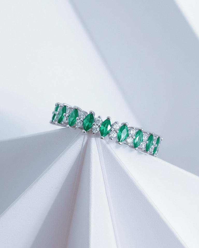 half band of emerald color marquise and round CZ.