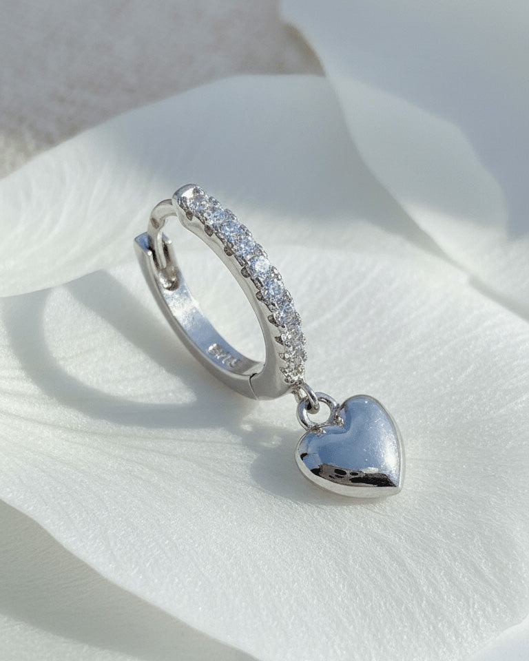 CZ huggie hoop earring with dangling plain heart shape.