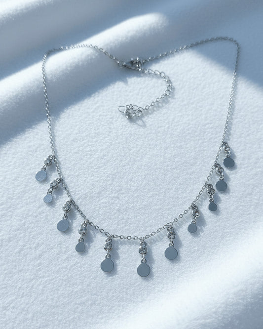 choker of plain disks shapes with CZ in bezel setting.