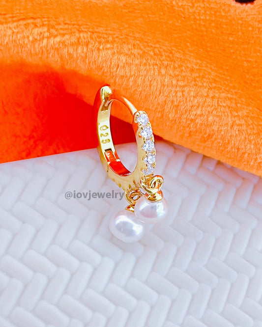 CZ huggie hoop earring with dangling two pearls.
