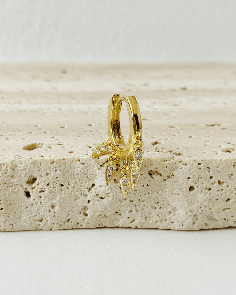 plain huggie hoop with dangling kite shapes with CZ.