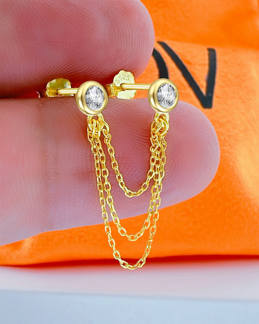 two stud CZ stones in bezel stones linked with triple chains.