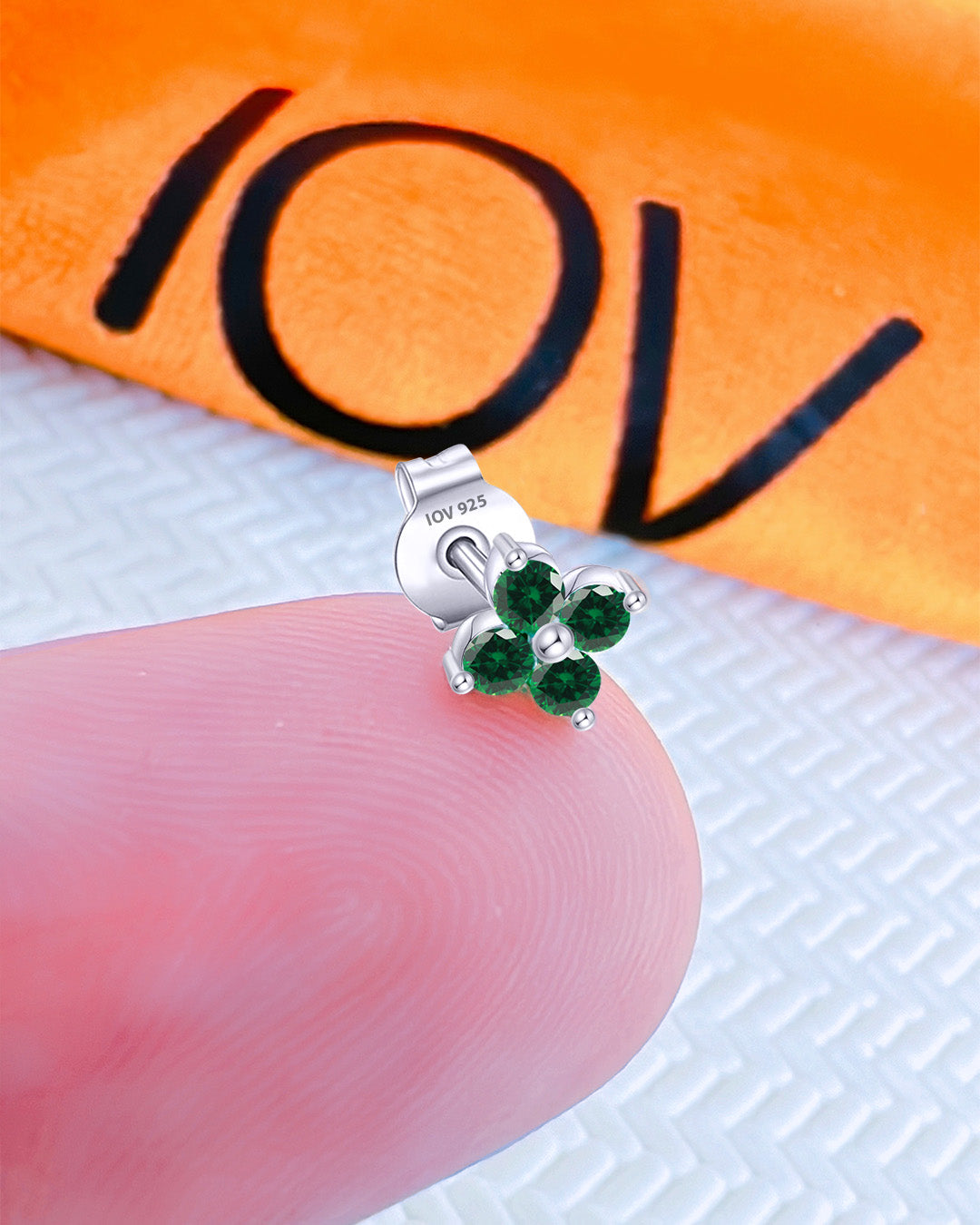 cluster of four CZ emerald color round stones stud earring.