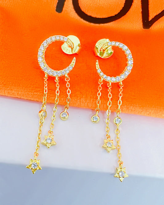 crescent shape stud earring with dangling chains.