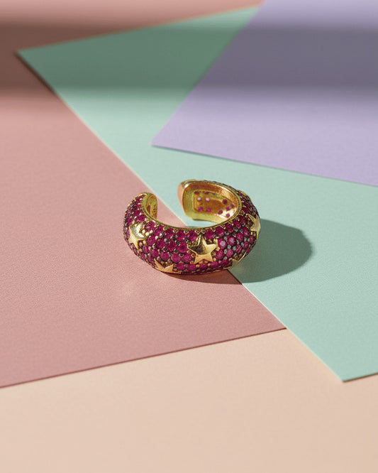 rose gold and yellow gold wide earcuffs with ruby and emerald color stones.