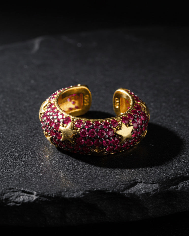 rose gold and yellow gold wide earcuffs with ruby and emerald color stones.