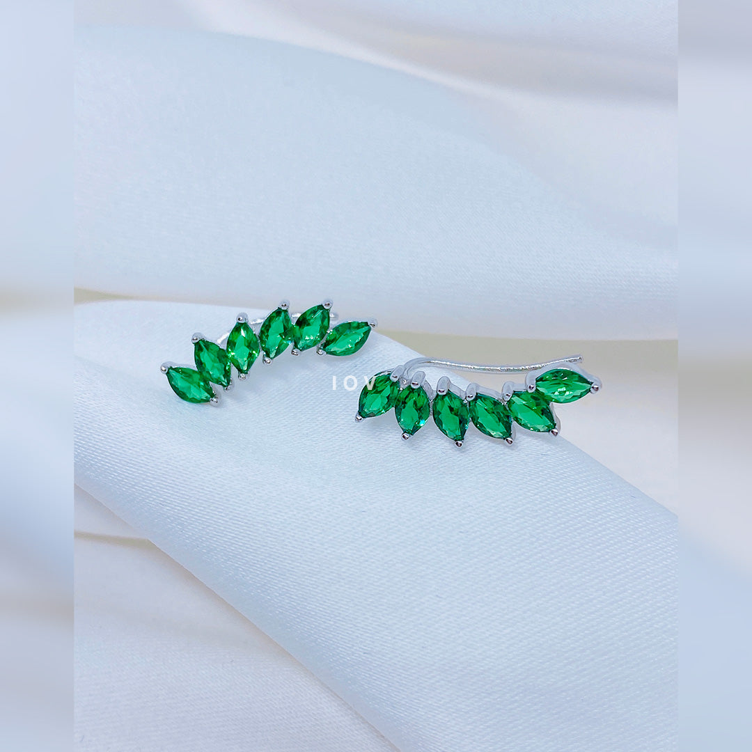 emerald color marquise stones curved climber earrings.