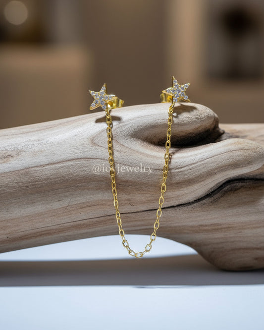 double CZ star stud earring linked with a delicate chain.