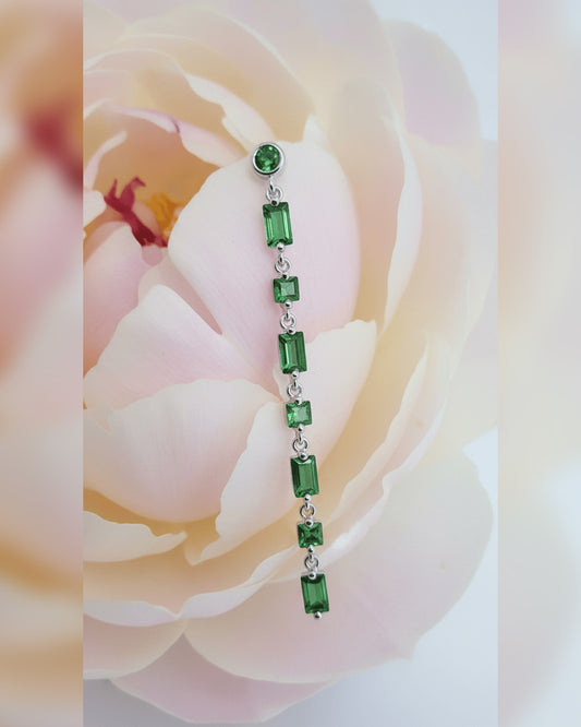 dangling line of round, square, rectanguar emerald color CZ stud earring.