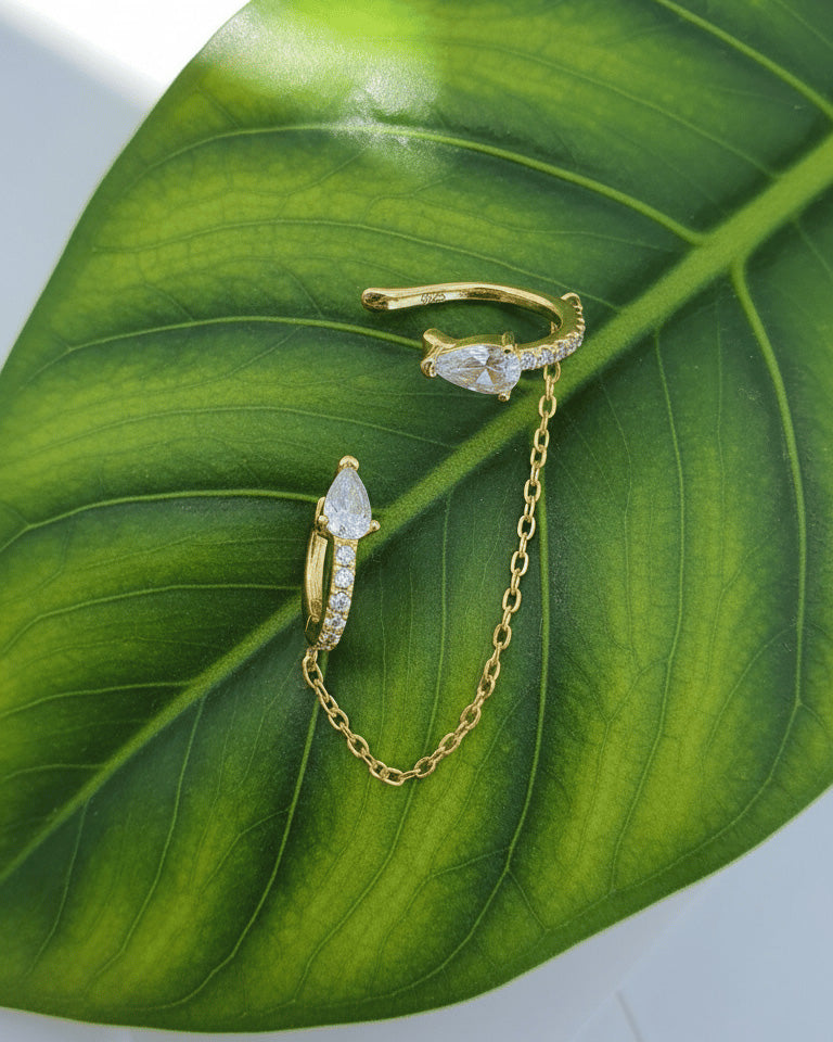 Pear and round shape huggie hoop linked with matching earcuff.