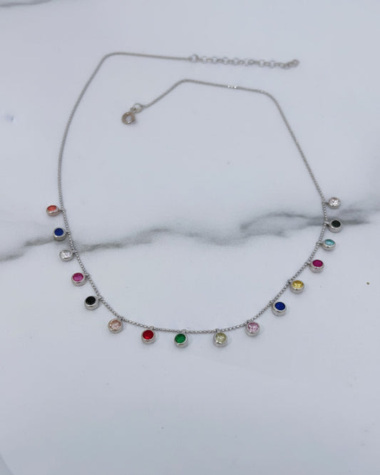fine necklace with colored dangling CZ in bezel setting.