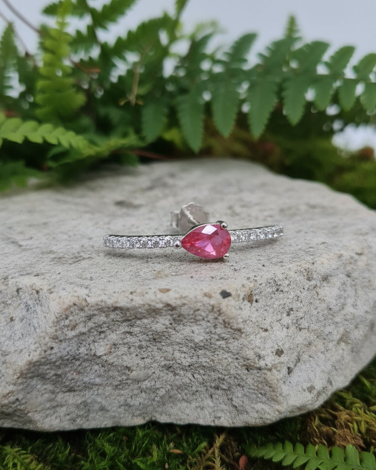 curved CZ line with pear colored stone stud earring.