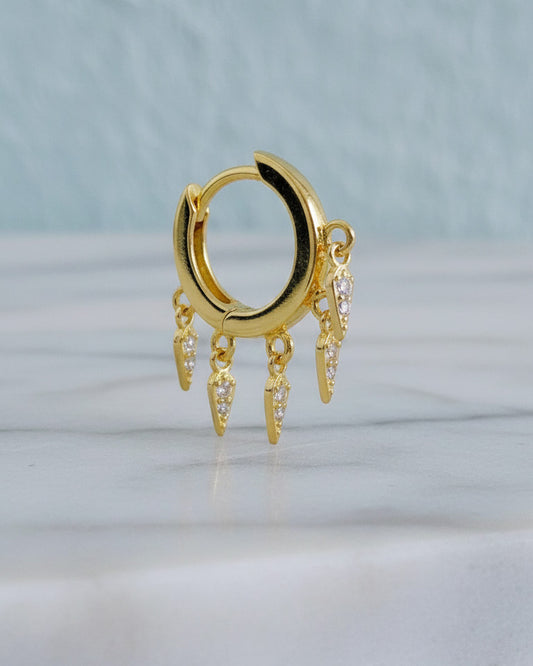 plain huggie hoop with dangling CZ kite shape earring.