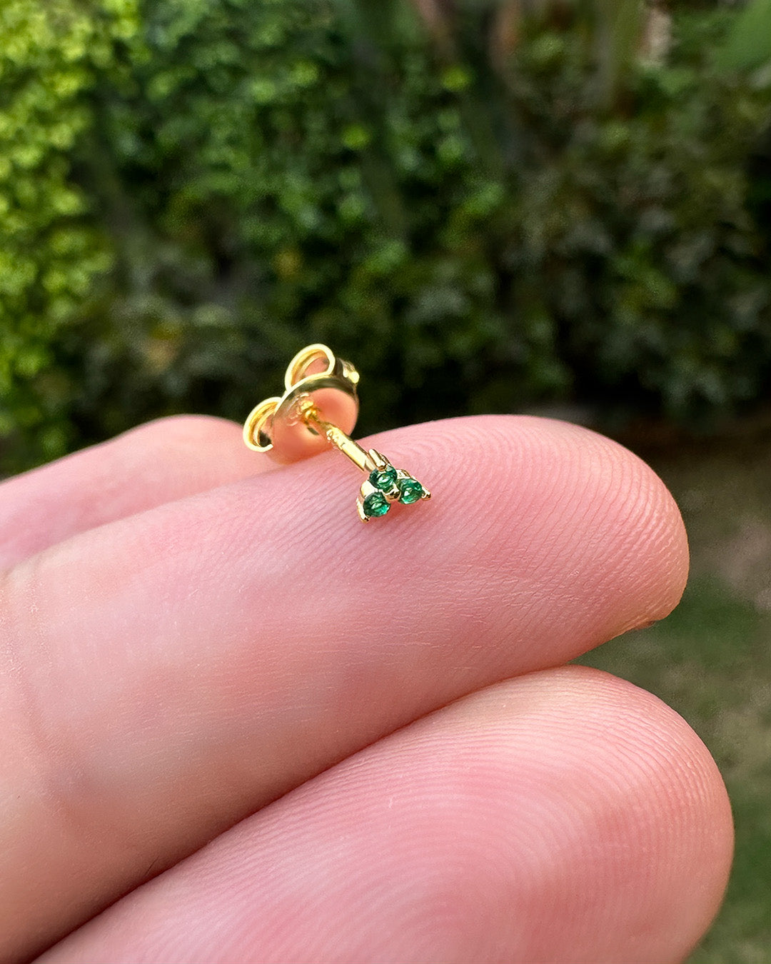tiny three stones emerald color stud earring.