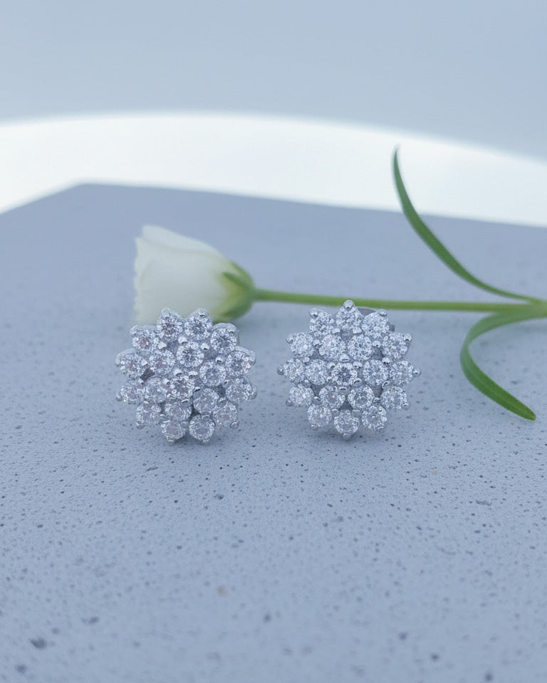 Cluster of round shape CZ in a flower shape stud earring.