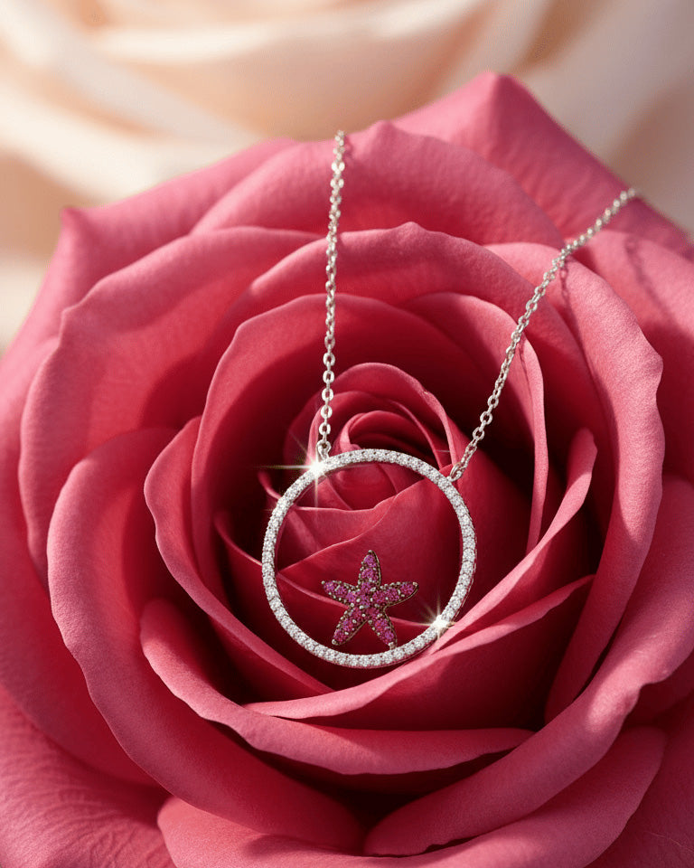 Circle necklace with a ruby color star necklace.