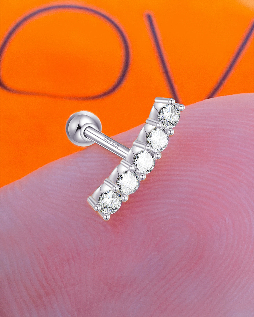 one size round CZ stones in a curved line ballback piercing earring.