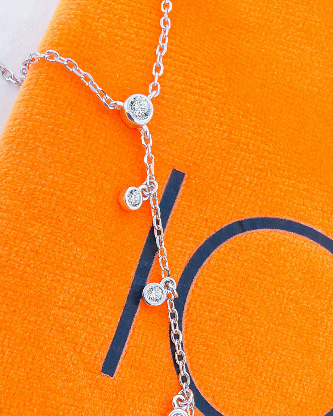 Y shape necklace with dangling star and CZ in Bezel setting.