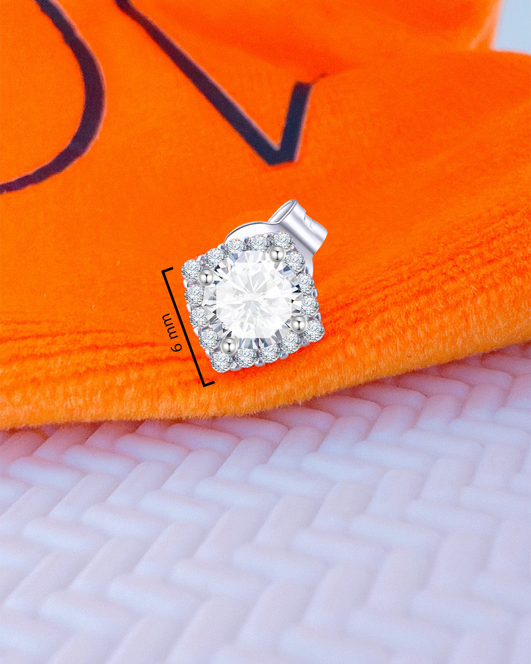 CZ round stone in a square halo setting stud earring.
