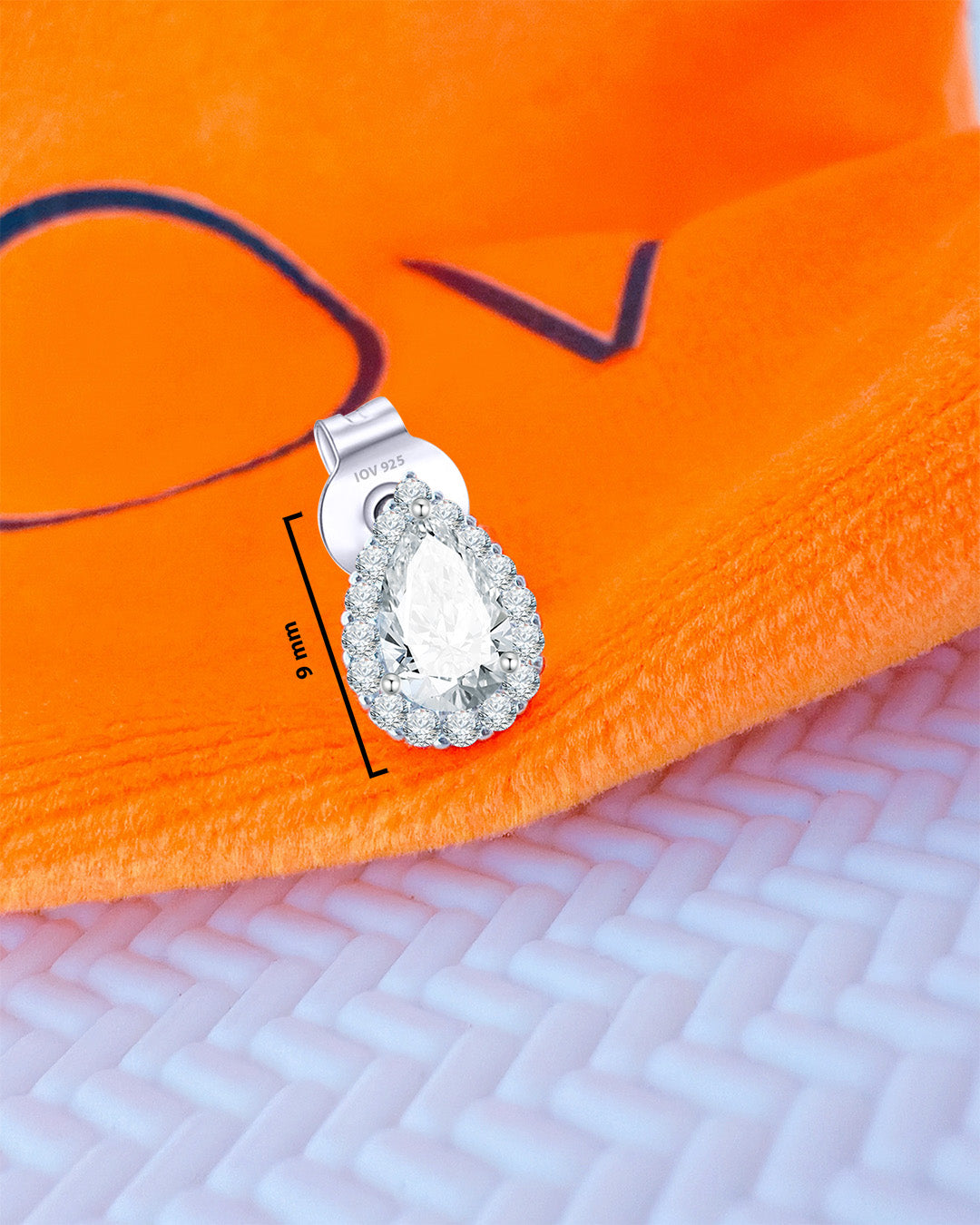 CZ pear shape in a halo setting stud earring.