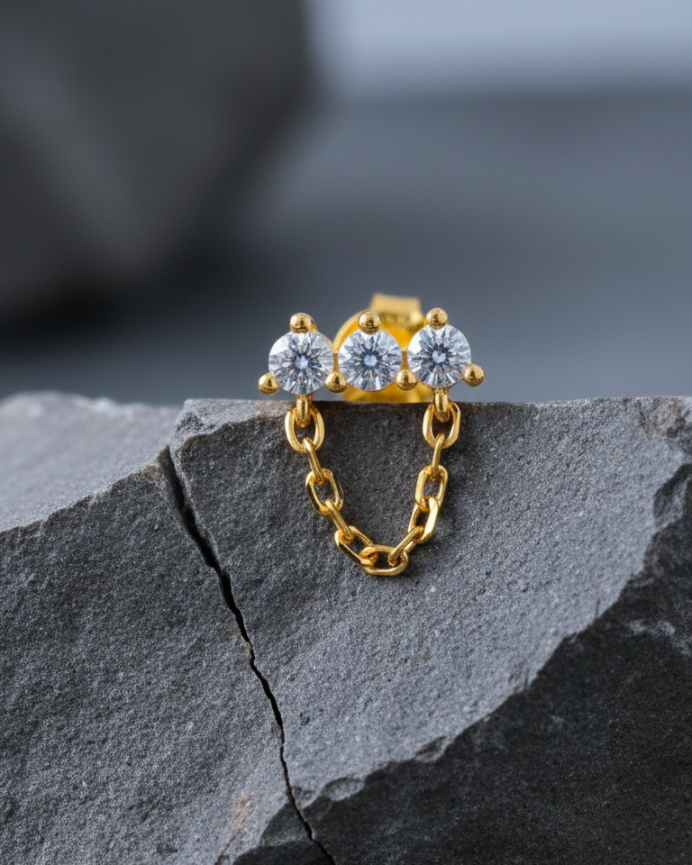 three stones bar earring with dangling chain.