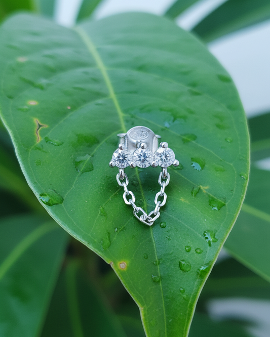 three stones bar earring with dangling chain.