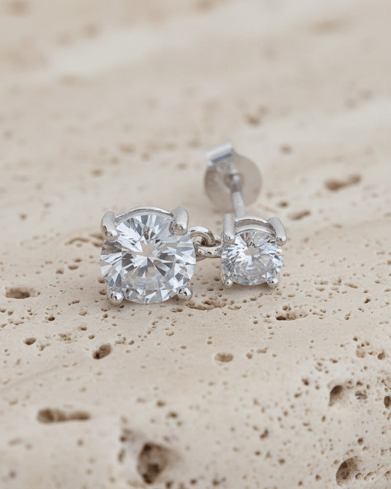 Two graduated round CZ stones stud earring.