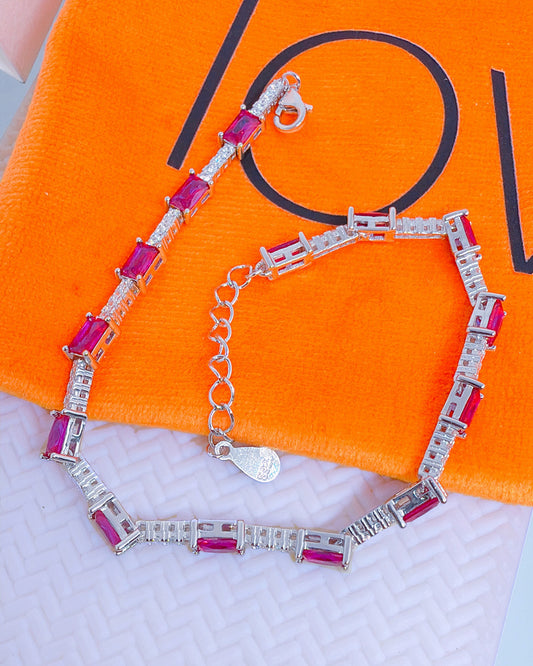 tennis bracelet with rectangualr pink and emerald color CZ.