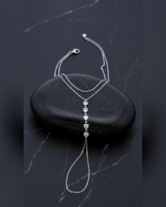Delicate chain handpiece of five round CZ stones.