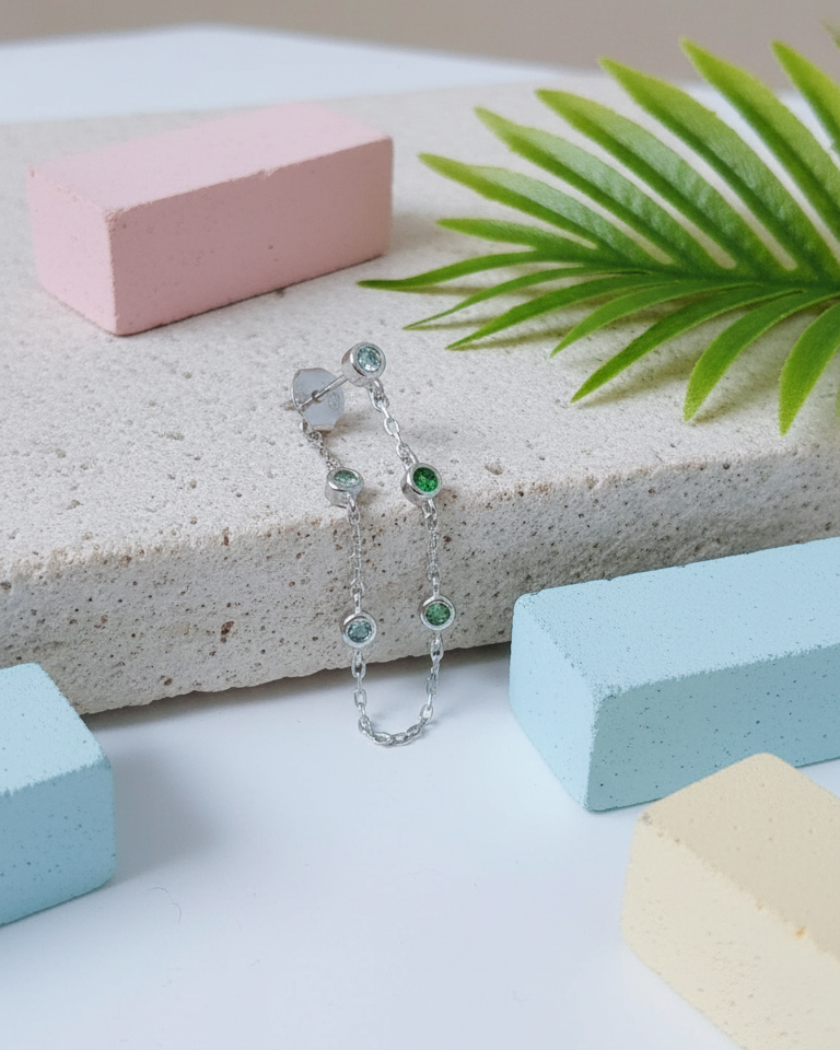 back to front minimal chain earring with graduated CZ color.