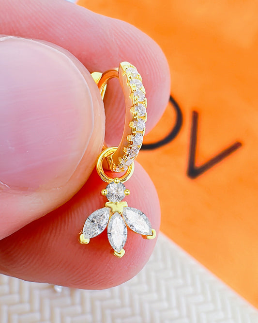 CZ huggie hoop earring with dangling marquise shape stones.