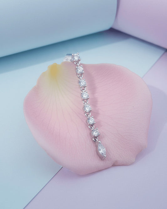 line of delicate links with round CZ ends with a marquise shape stud earring.