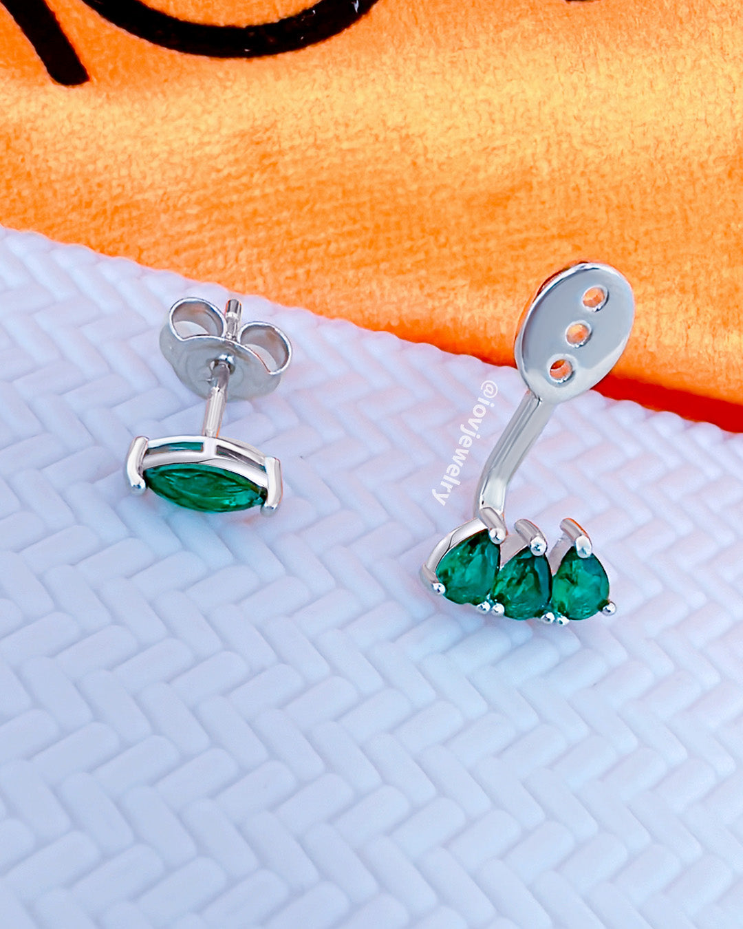 Back and front emerald color marquise and pear shape CZ stones.