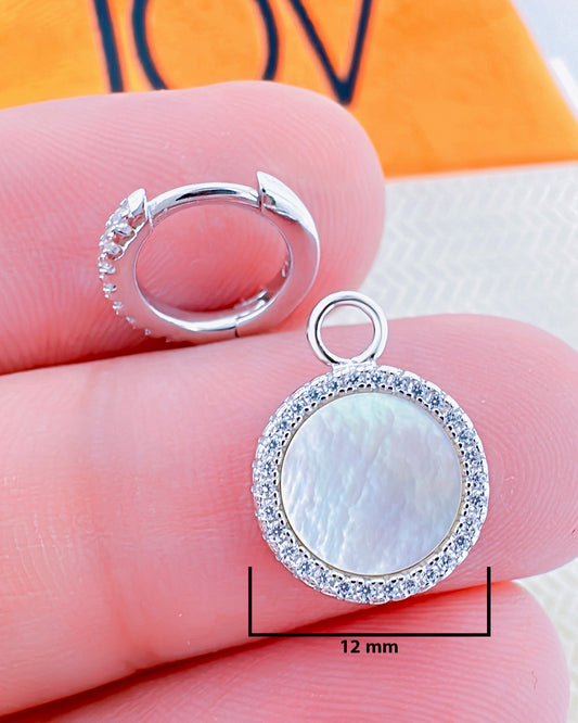 9mm CZ hoop earring with a mother of pearl dangling in a halo setting.
