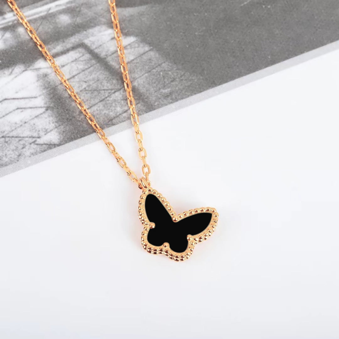 mother of pearl and agate butterfly rosegold necklace.