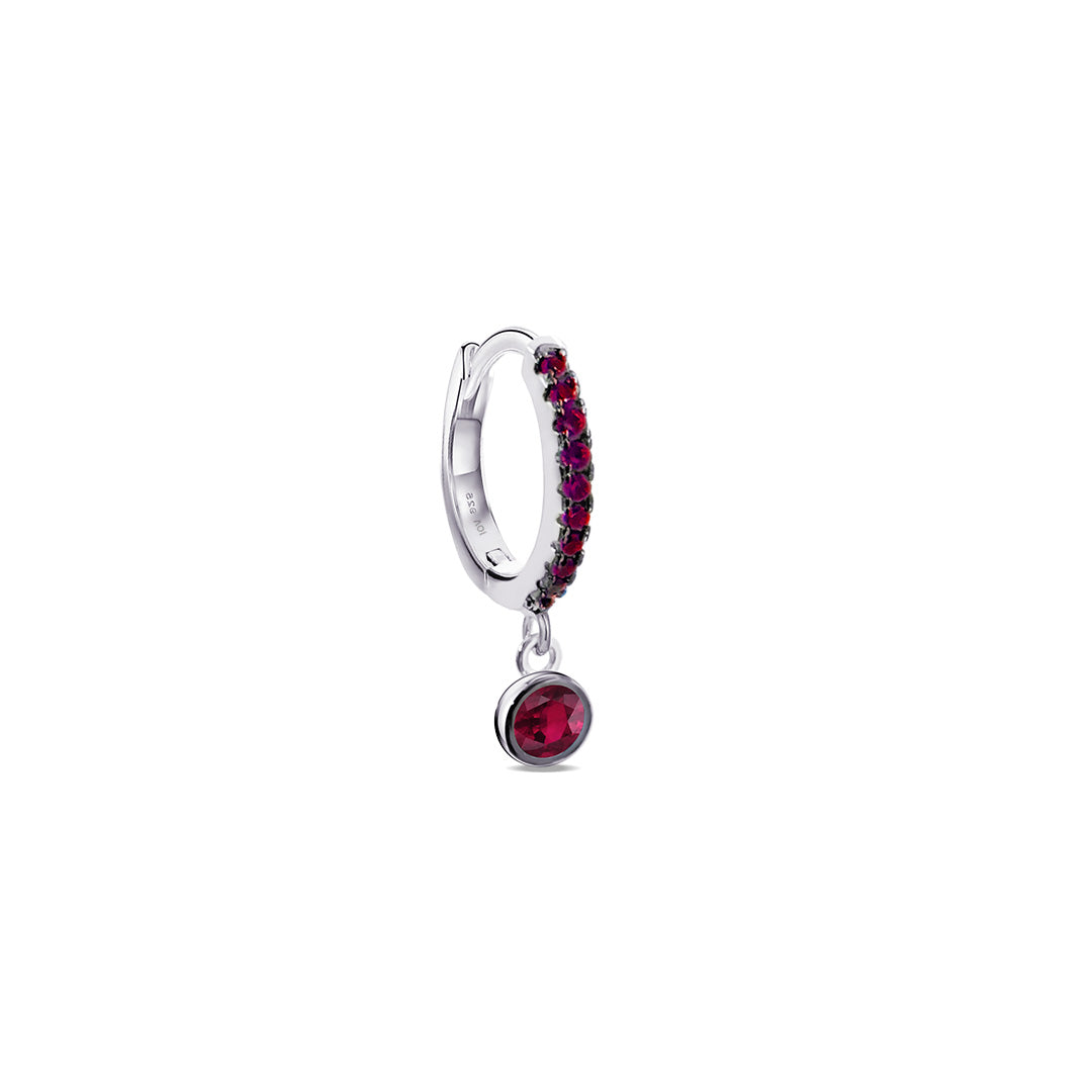 geen and pink hoop earring with dangling round stone in bezel setting.