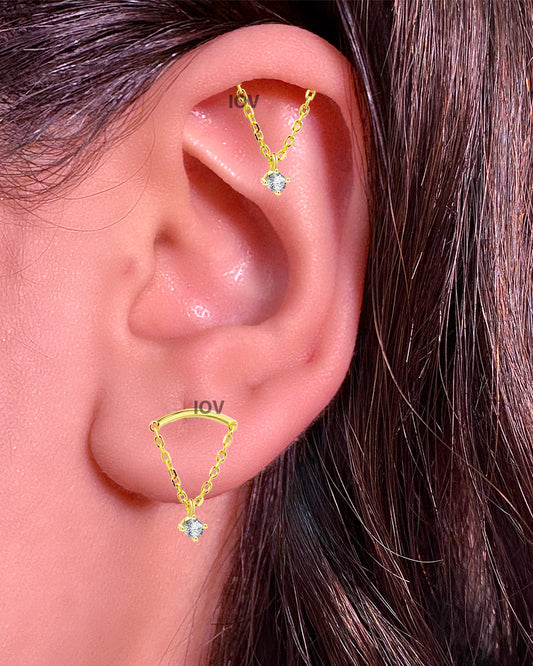 plain curve bar with dangling round stone stud earring.